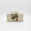The Auor Clutch in white with geometric brooch design