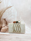 Three stone criss cross clutch multi