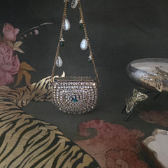 Mini kundan bag with hint of green in antique gold