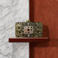 Meenakari filigree clutch bag in gold with filigree detailing