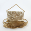 Flaura Bag in gold hand-embroidered envelope style bag