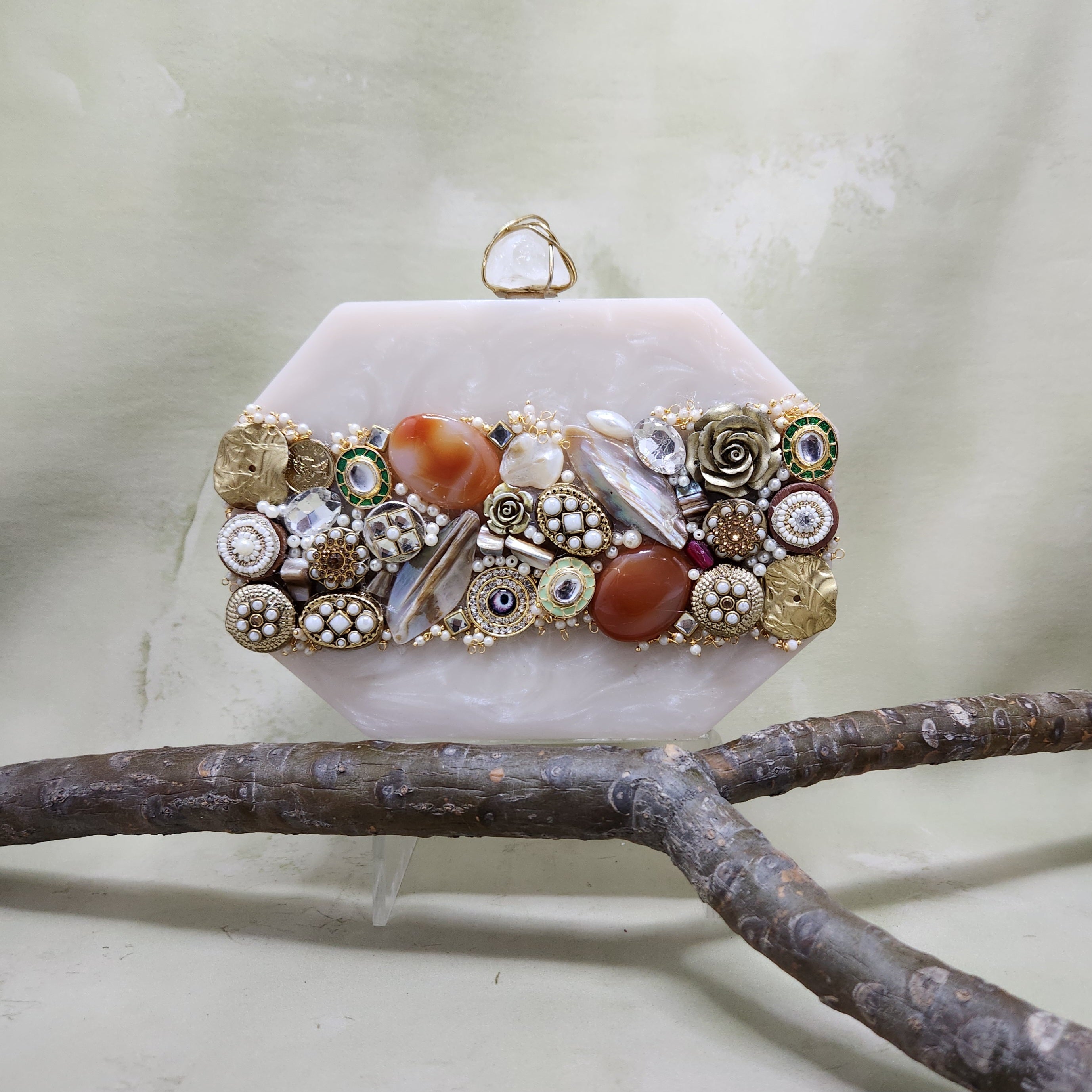 The Meena mosaic clutch