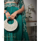 The Pearl Half Moon Bag in silver with mother-of-pearl detailing