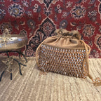 Golden crystal and suede potli bag