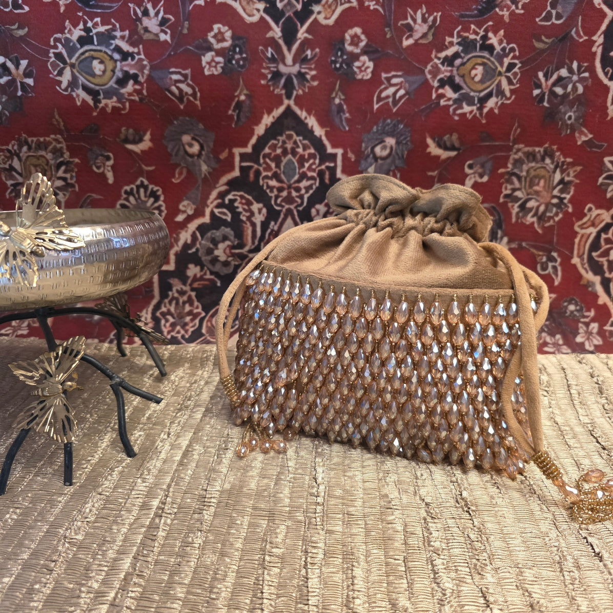 Golden crystal and suede potli bag