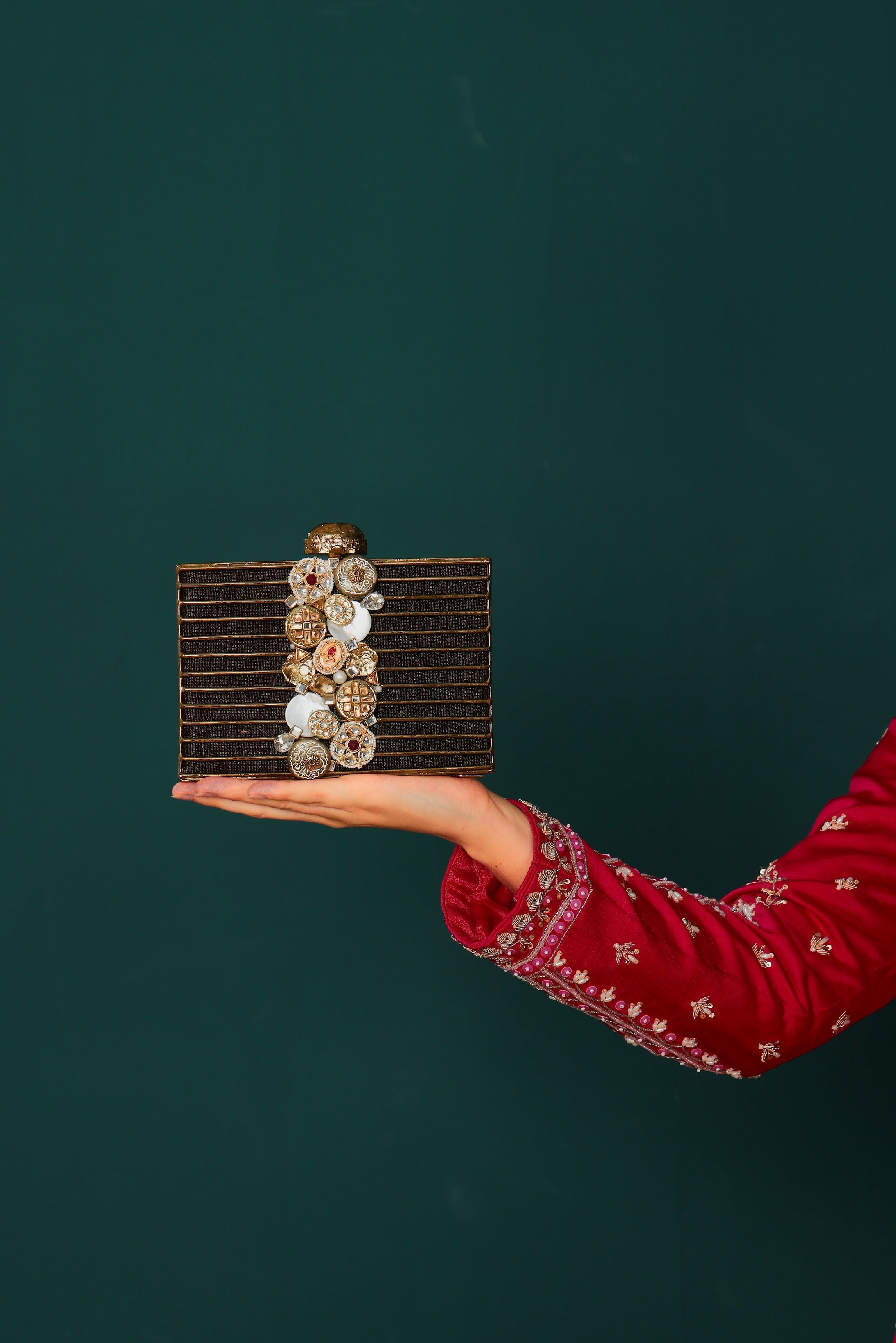 Raas bag in antique gold with natural stone detailing