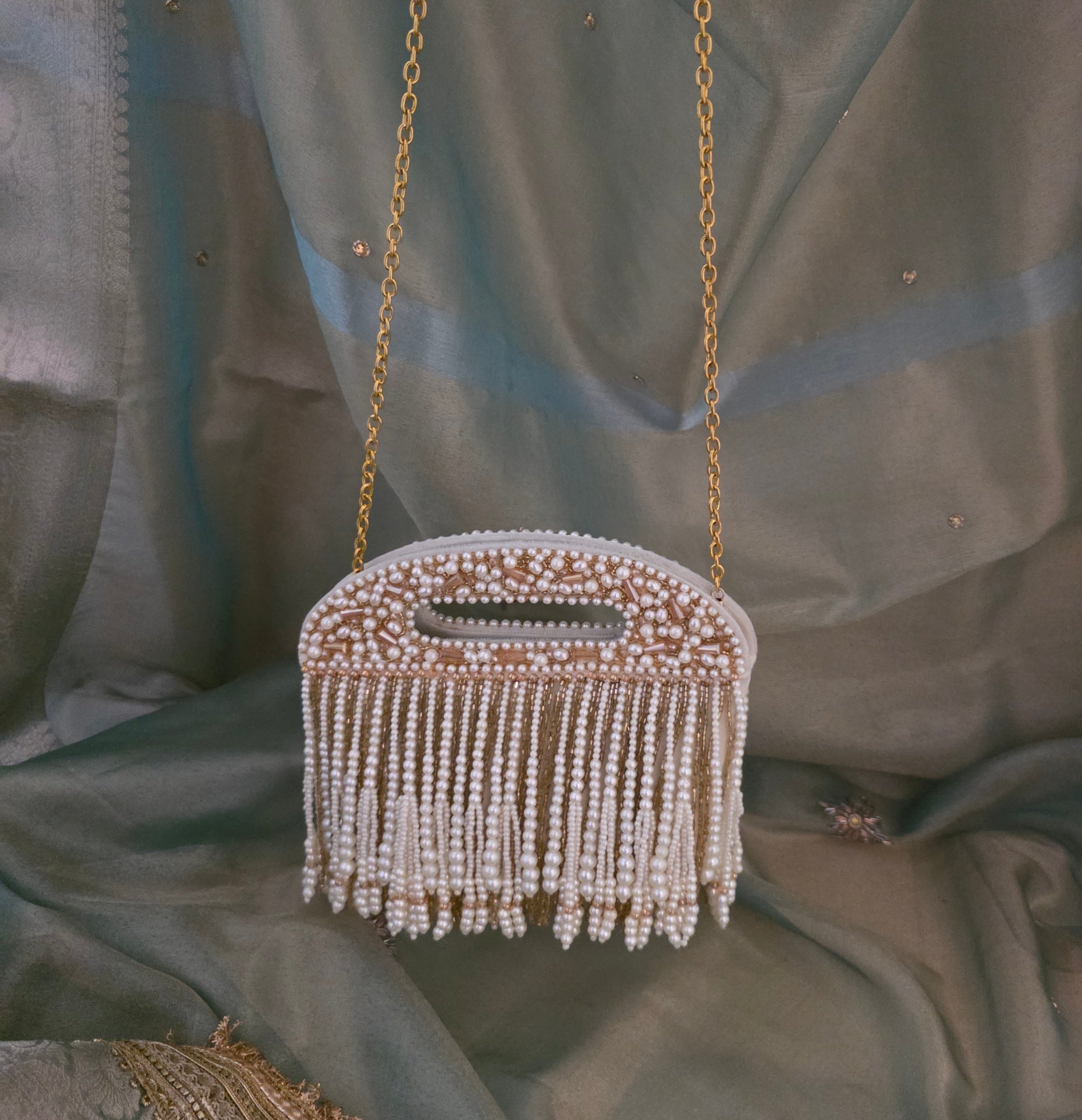 Falling pearl clutch bag