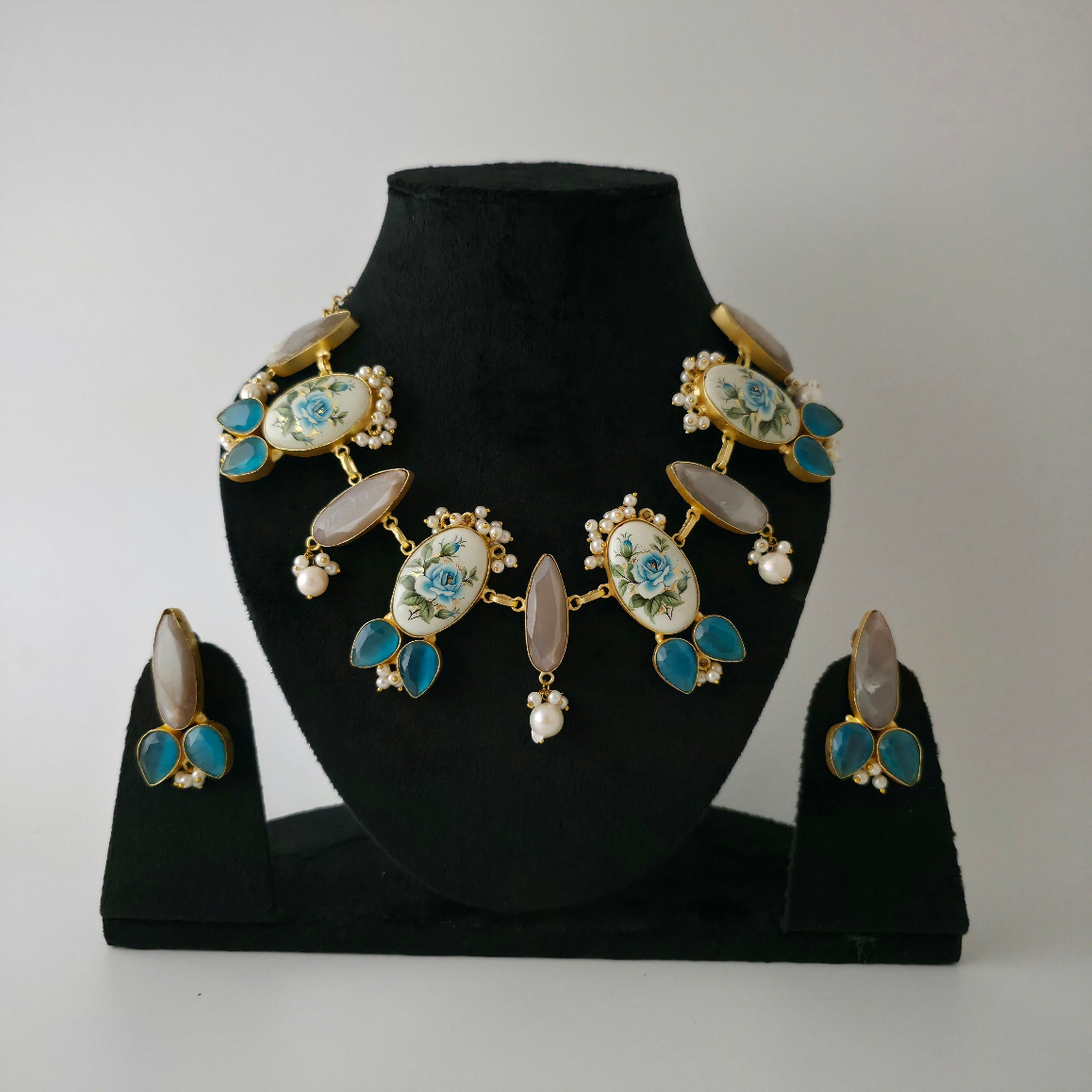 Rose print necklace with monalisa stone in shades of blue and grey Main image